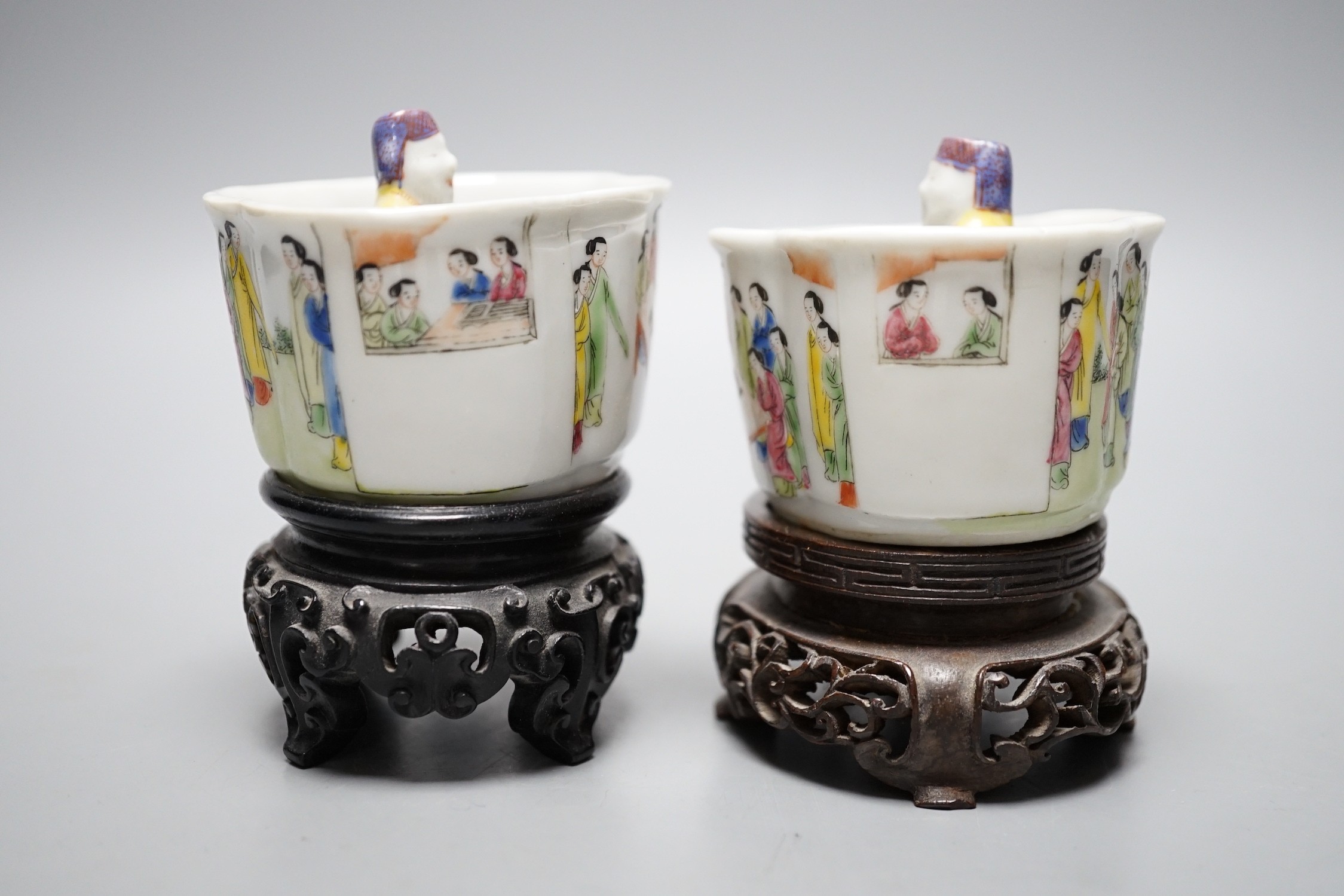 A pair of 19th century Chinese famille rose puzzle cups on stands, 8cm tall overall